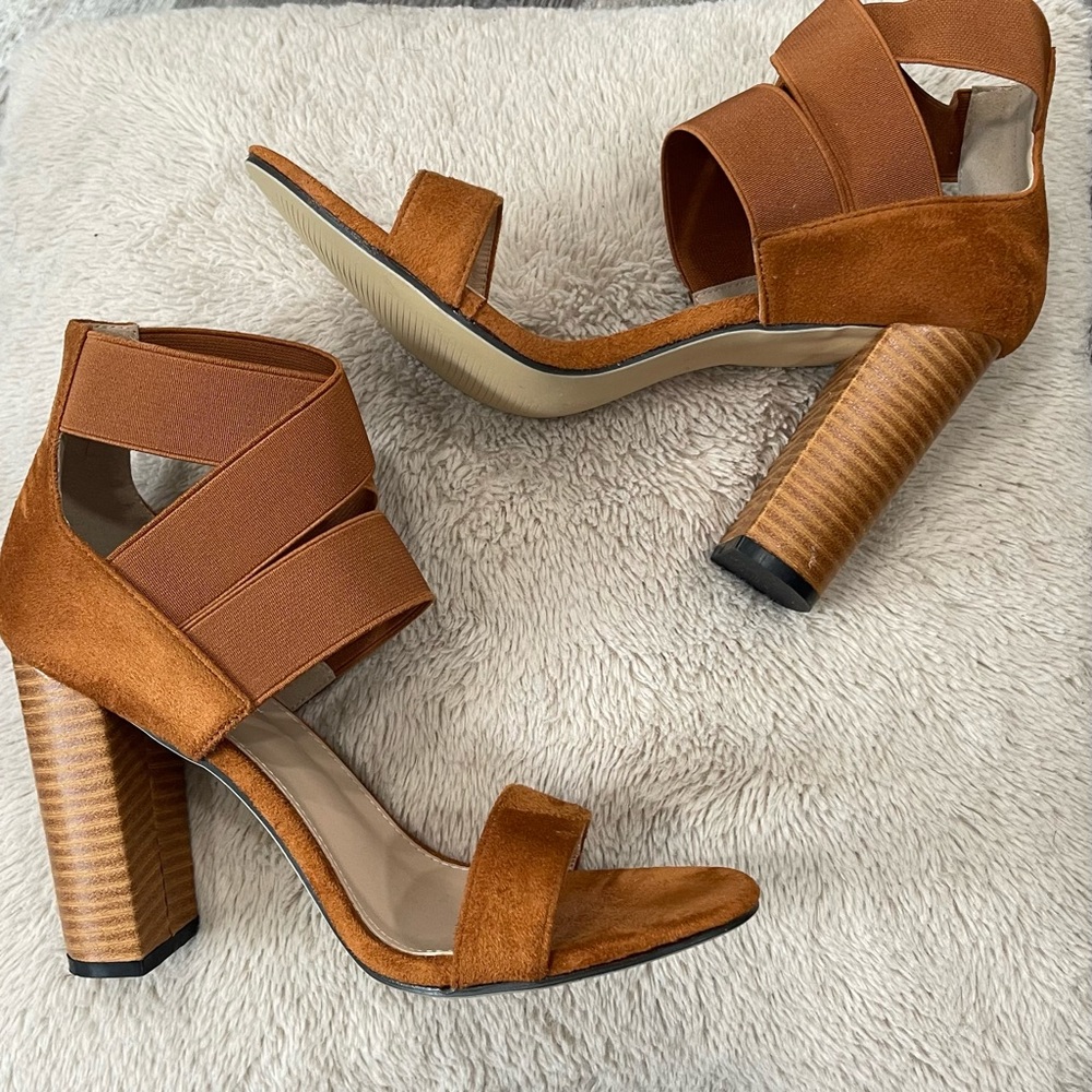 Burnt orange heals with elastic ankle straps.